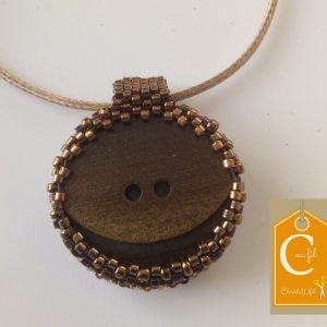 Pendentif brun serti de perles bronze (vendu)