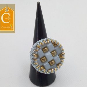 Bague bouton bleu ciel carrés or